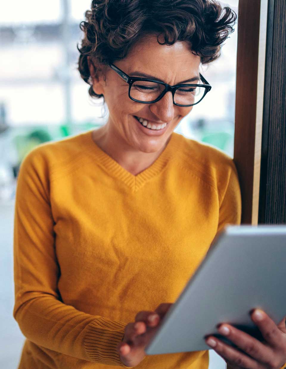 woman looking at her digital investment portfolio online